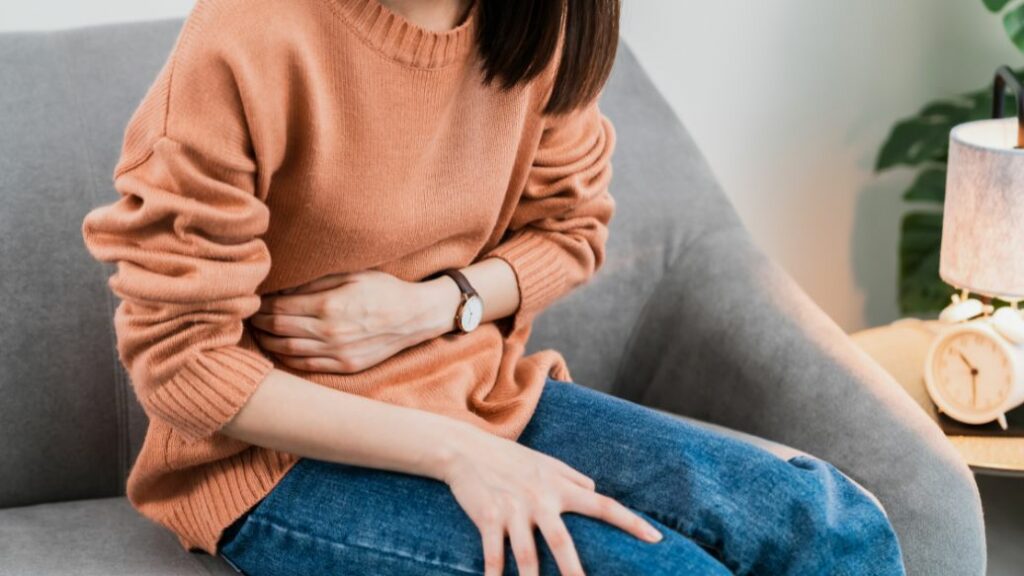 Person experiencing nausea while taking Mounjaro, a GLP-1 medication used for weight management and diabetes treatment.
